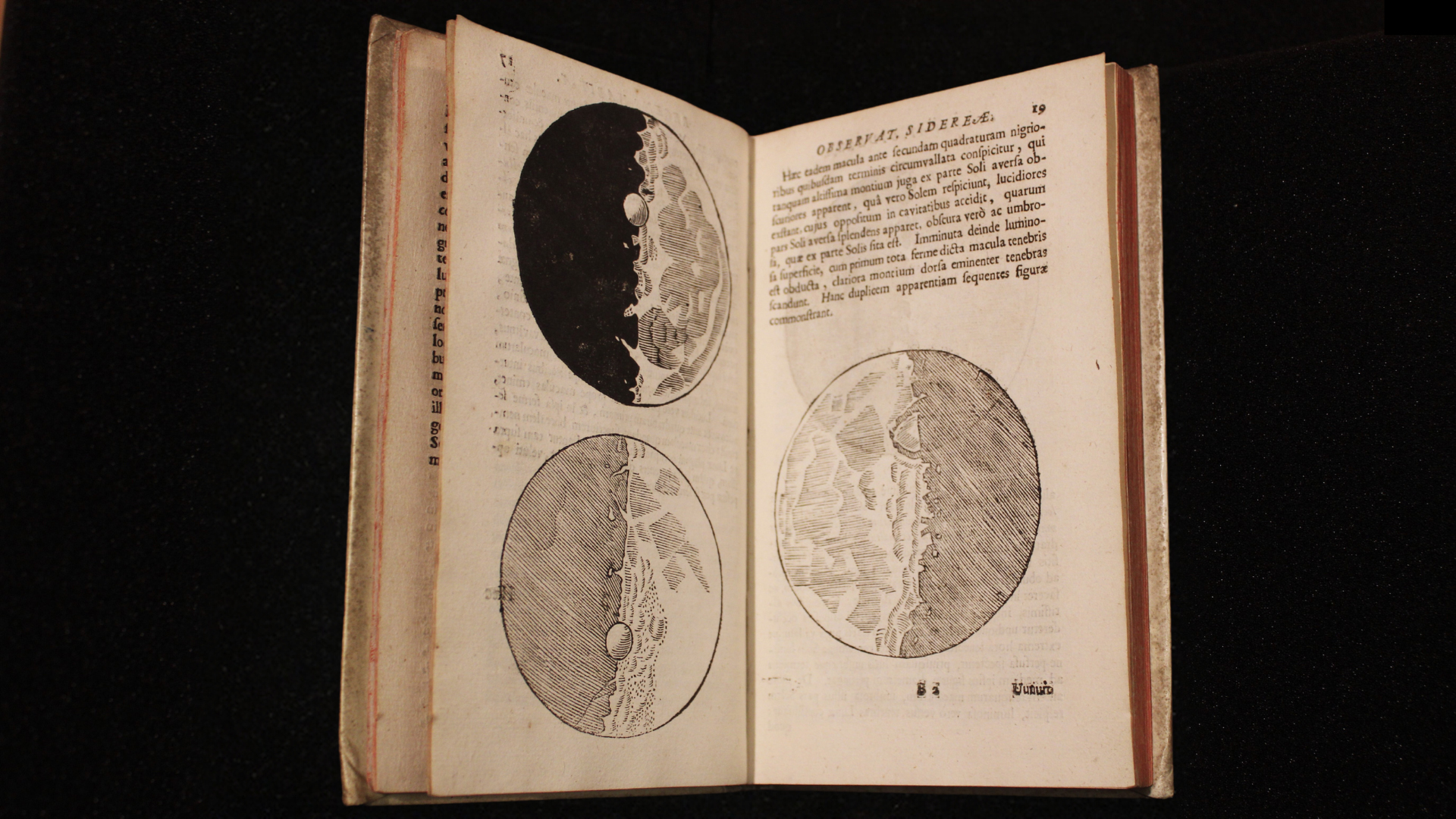 Galileo Night Lecture 2024 Color photograph of an open book against a black background; the book is open to pages with drawings of the moon