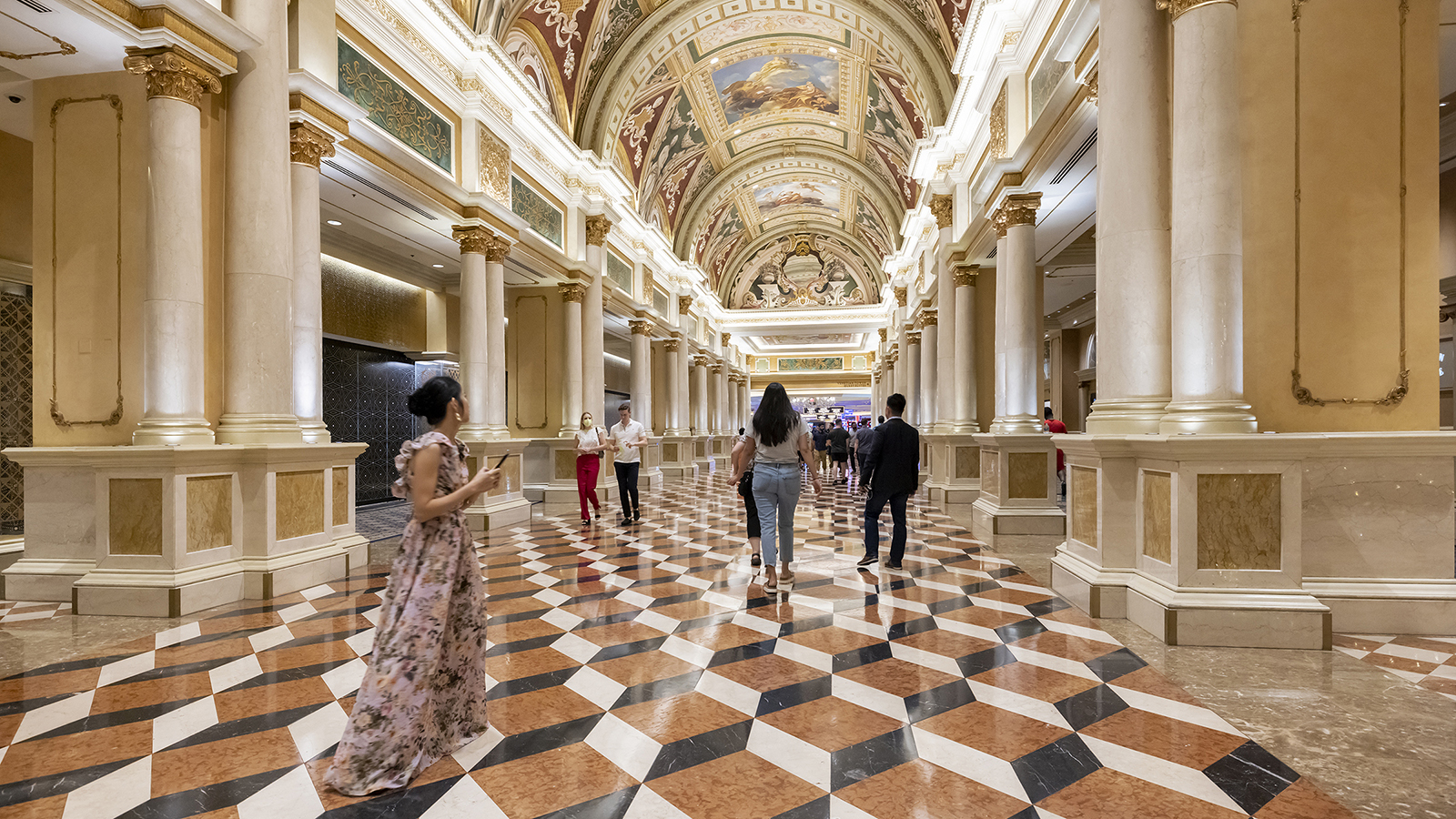 Iwan Baan - Las Vegas interior Color photograph of the interior of a Las Vegas hotel or casino, with three-dimesional looking square cube floors and a barrel vaulted ceiling painting with frescos