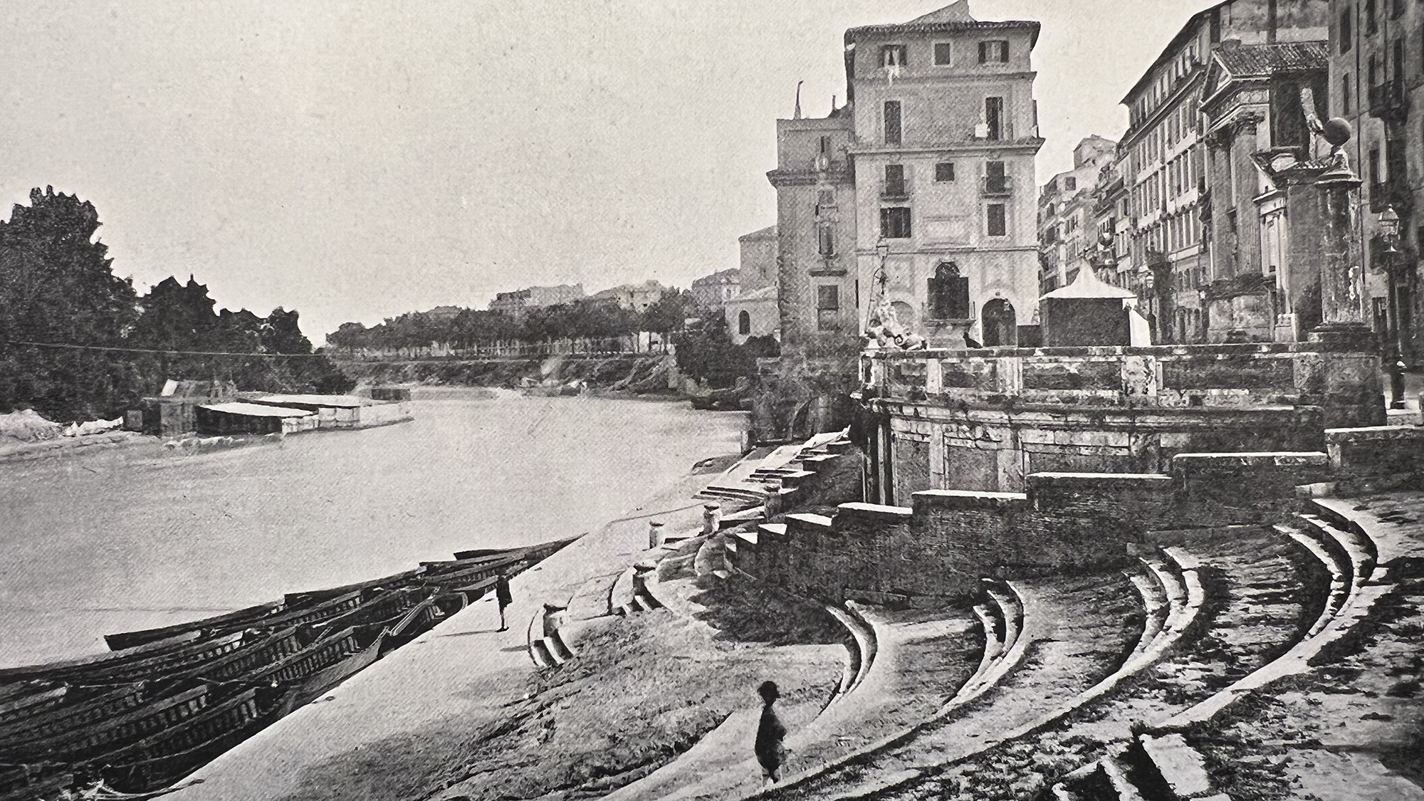 Lindsay Harris Lecture 2022 Monochrome photograph from the late 19th century showing a river on the left and a few scattered buildings on the right
