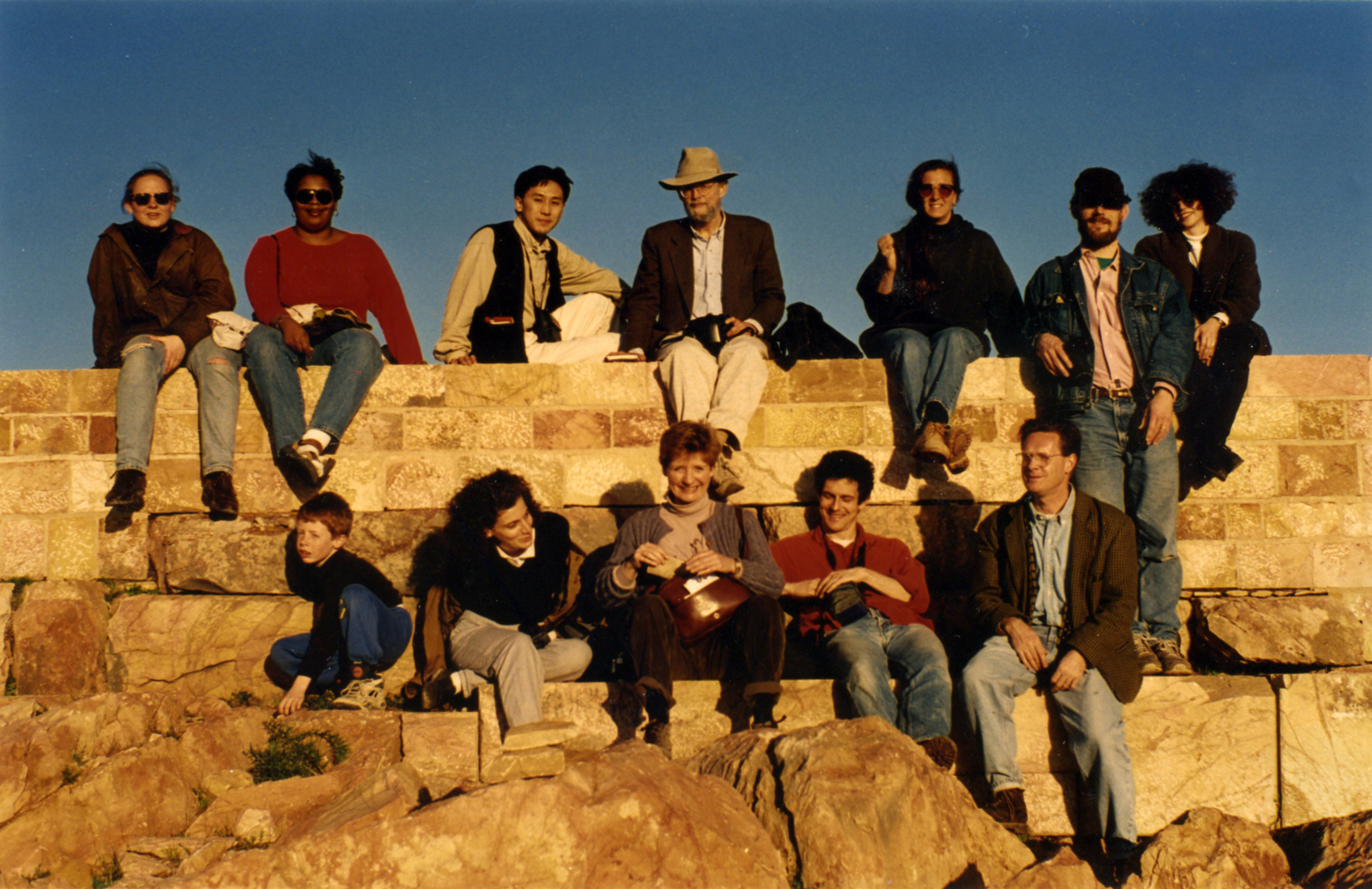Malcolm Bell Tunisia color photograph of men and woman sitting on an ancient staircase in Tunisia