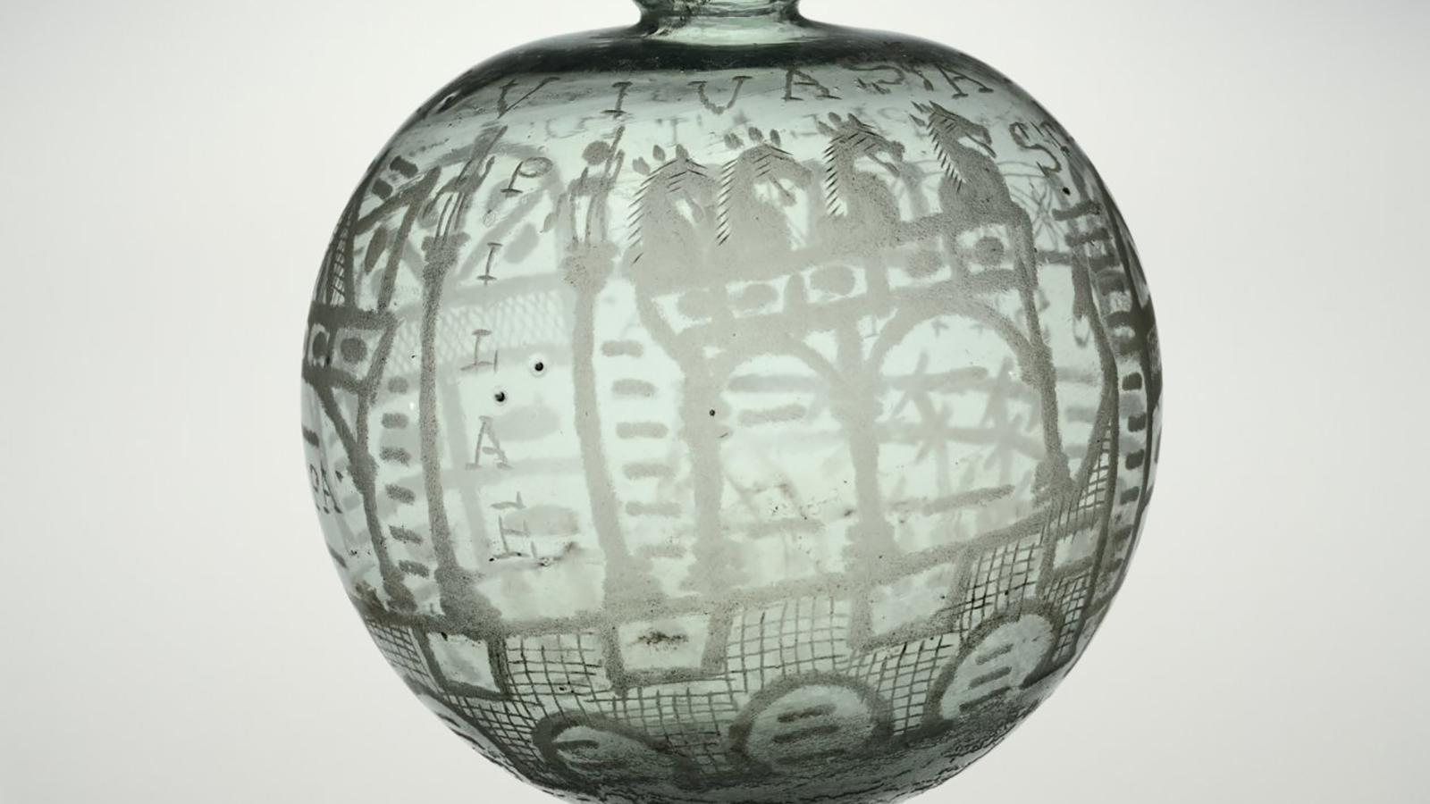Shoptalk - Maggie L. Popkin Color photograph of a very pale green ancient glass vessel painted with architectural elements, horses, and geometric patterns