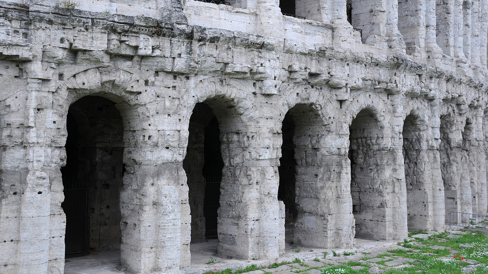A close up view of the exterior of the Colosseum