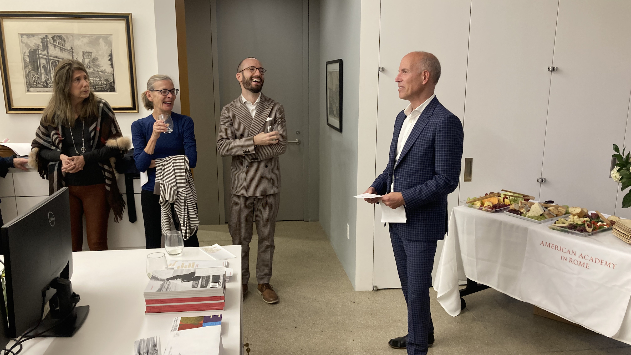 Four people in a room in a party atmosphere