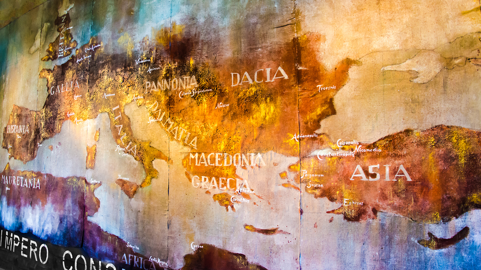 Ancient painted wall mural of the Roman empire in the broader Mediterranean, foregrounding Asia Minor, Eastern Europe, and Greece on the right; Italy, Gaul, and Spain on the left, and northern Africa along the bottom