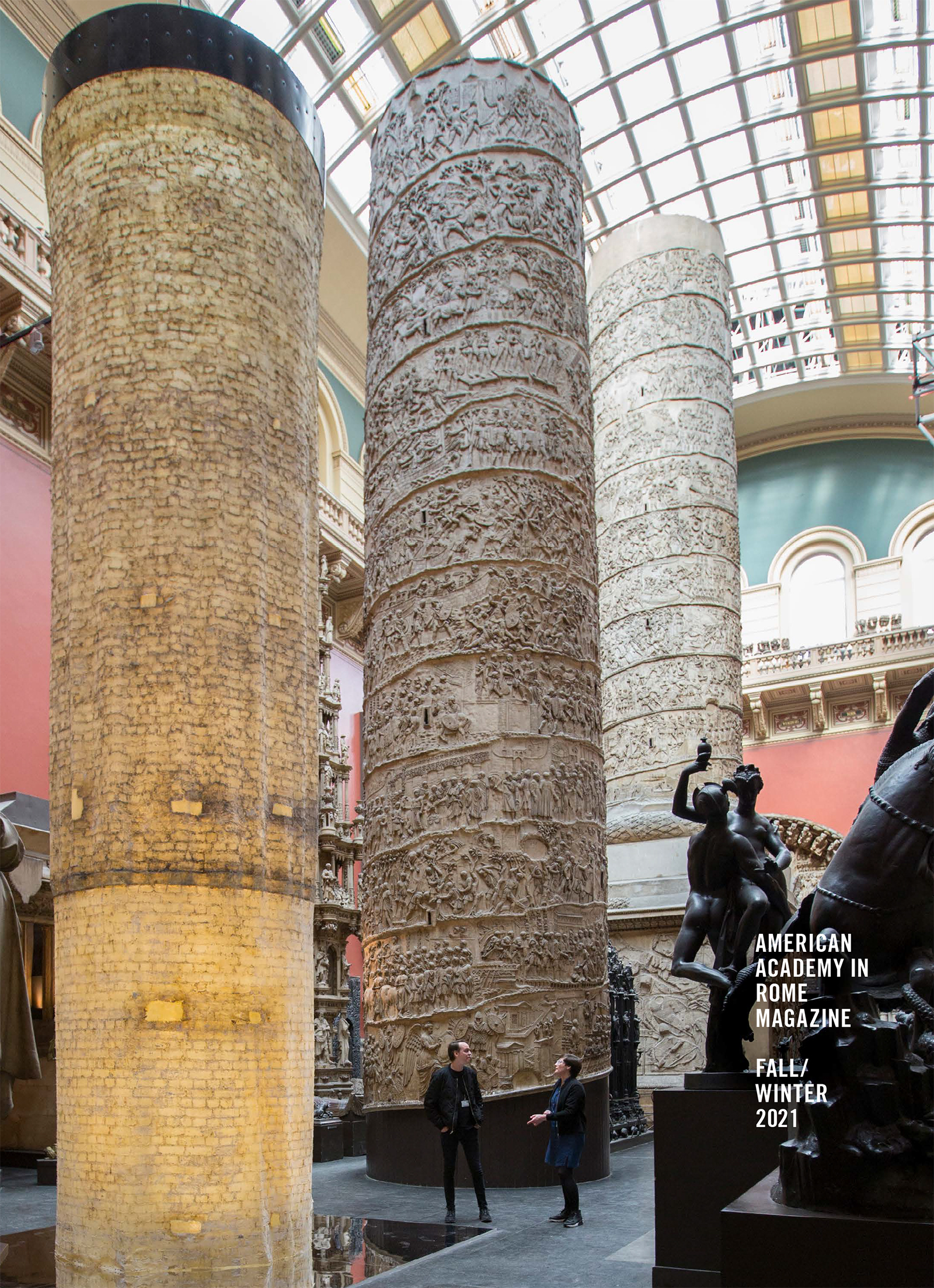 Cover of the Fall/Winter issue of AAR Magazine, with a color photograph depicting a large room inside the Victoria and Albert Museum with two halves of a cast of Trajan's Column behind a cylindrical latex cast of the interior of one of the columns; two men stand talking between them, dwarfed by the immense scale of the column