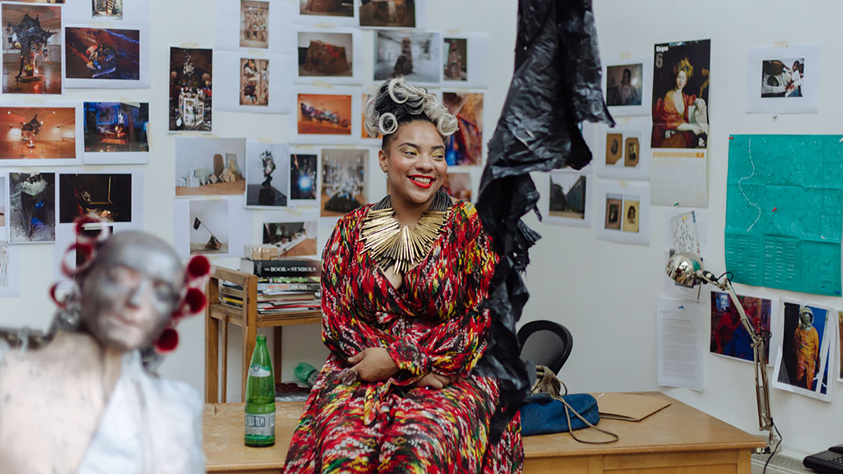 Color photograph of an artist in her studio