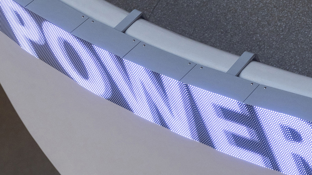 Color digital image of the word POWER on an LED screen, affixed to a rotunda wall at the Guggenheim Museum