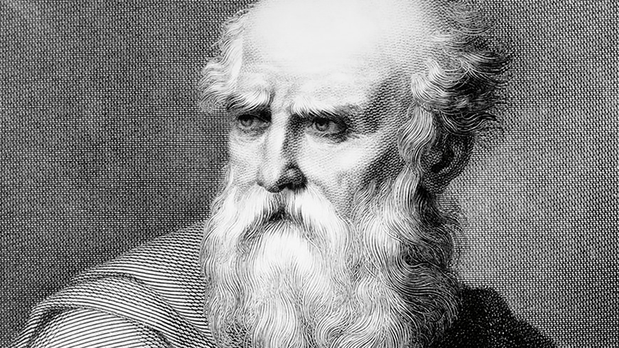 Detail of an old master engraving showing the face and long beard of an elderly white man