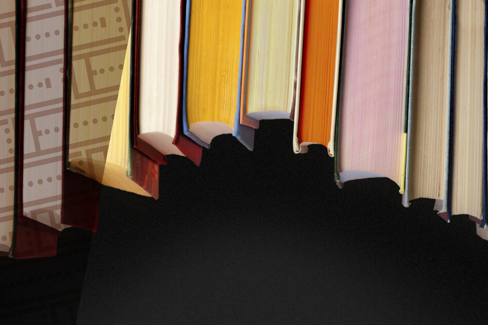 Cropped photograph of the cover art of a CD, showing an arc of hardcover books hanging upside down