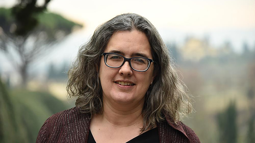 Color photograph of the head and shoulders of Rebecca Zorach in an outdoor location
