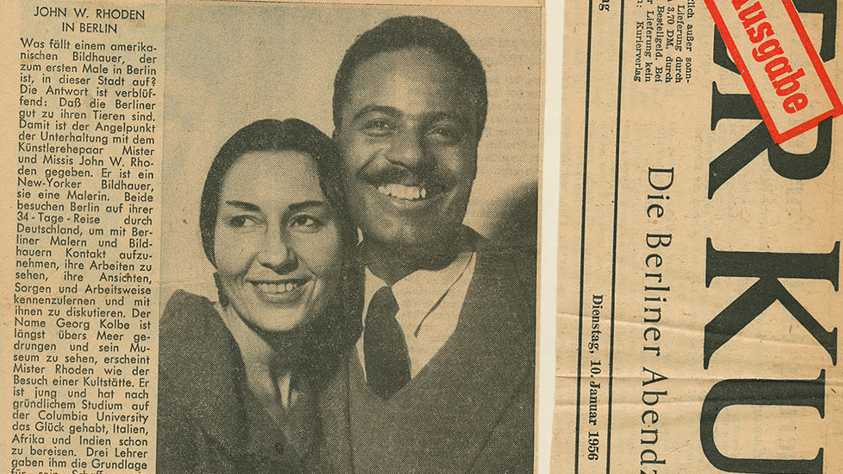 Color scan of a German newspaper with typeset text and a photograph of a man and a woman smiling