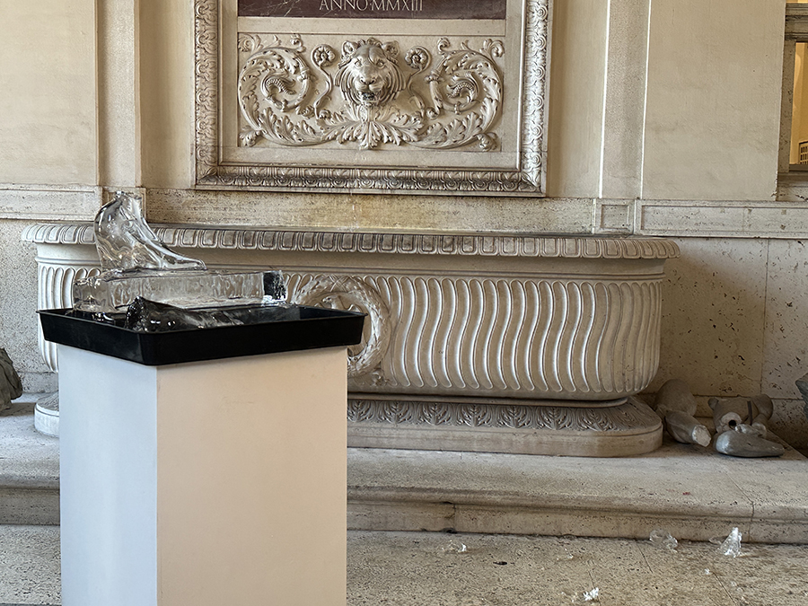 color photo of a melting ice sculpture in a roman patio