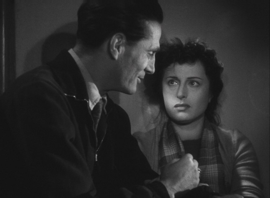 Still from Roberto Rossellini's film &quot;Rome, Open City&quot; showing a man in profile on the left and a woman facing forward on the right