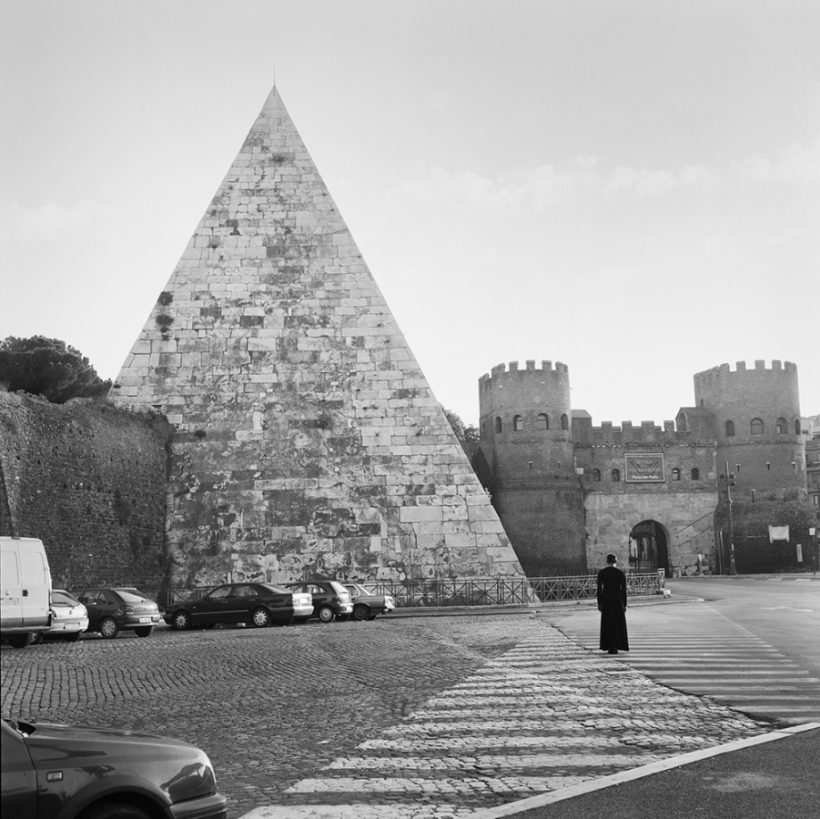 Black and white photograph by Carrie Mae Weems showing the Cestius Pyramid on the left and a woman on the right