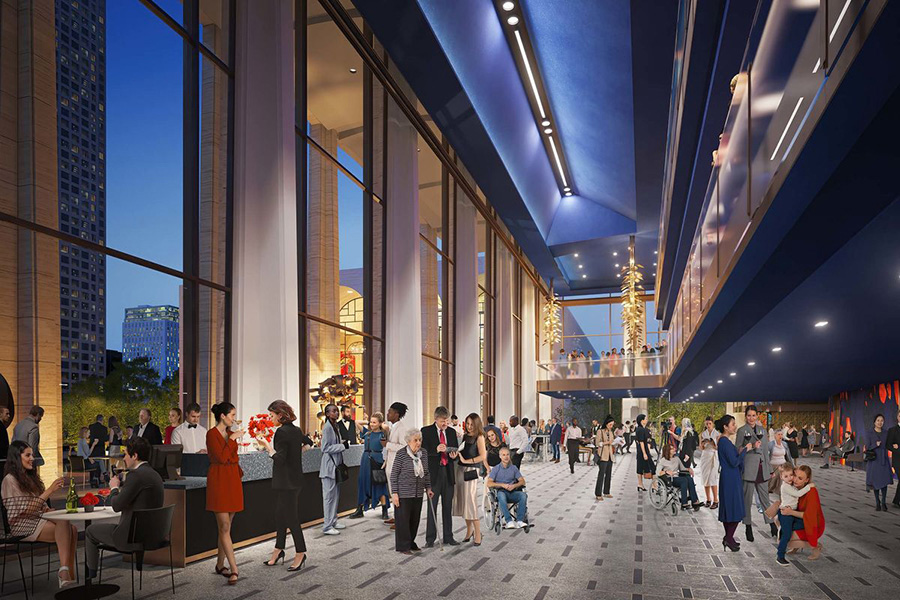 people socializing in a concert hall lobby