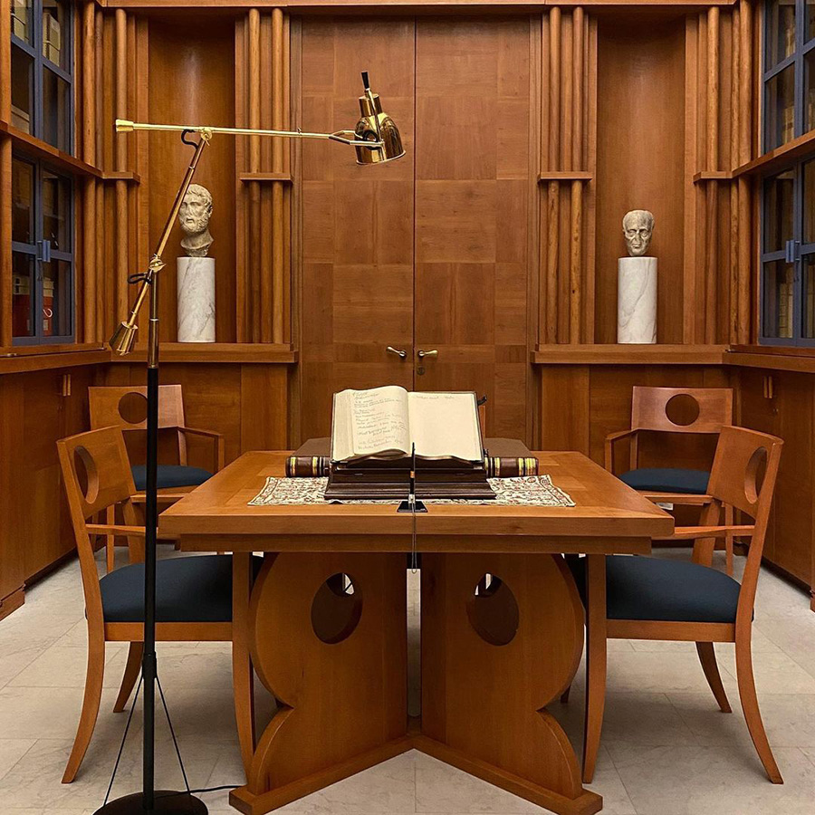 table in front of bookshelves