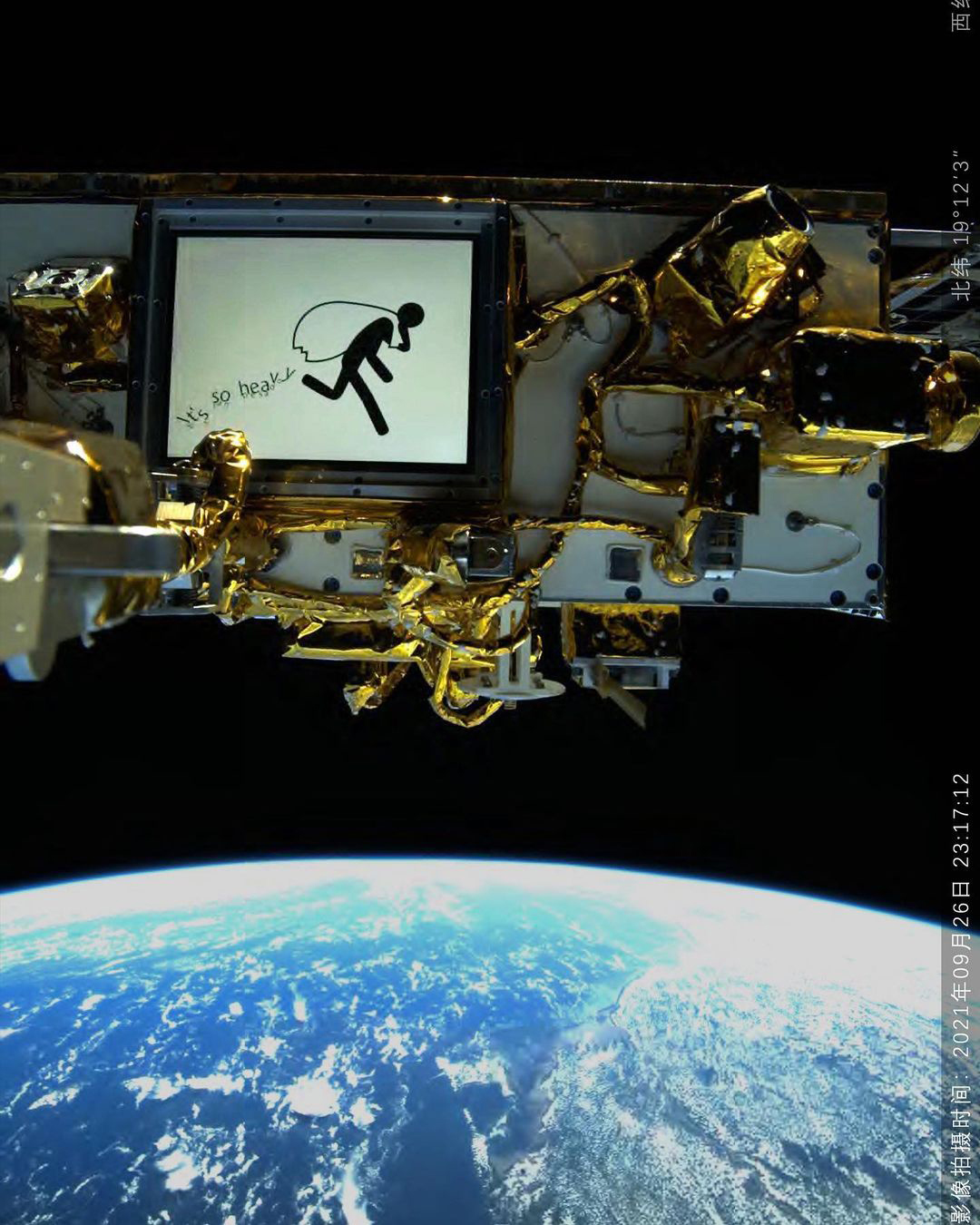 Color photo of a satellite orbiting earth