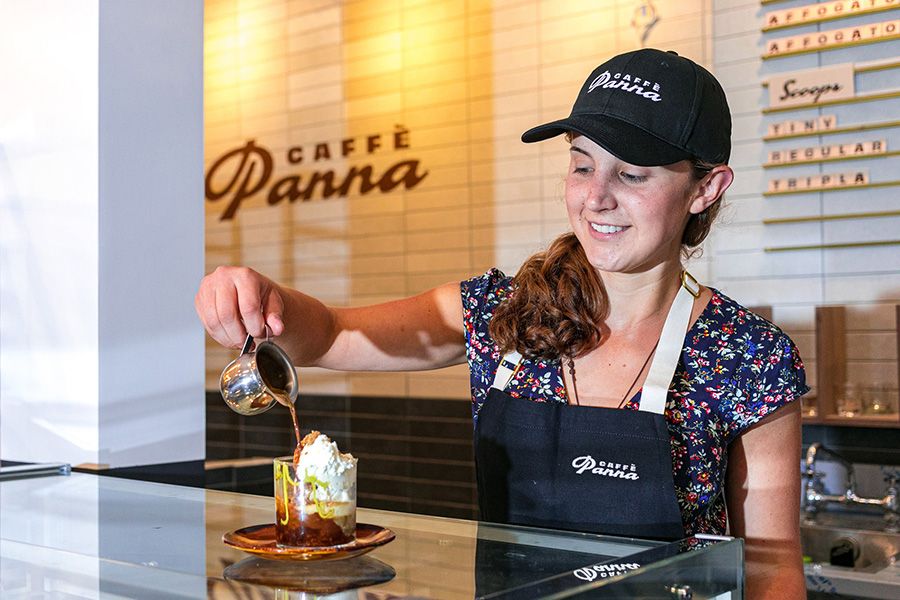 photo of barista serving a beverage