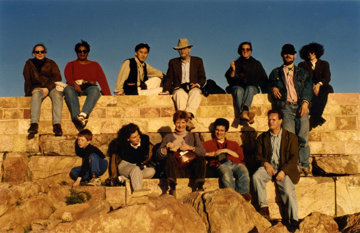 color photograph of men and woman sitting on an ancient staircase in Tunisia