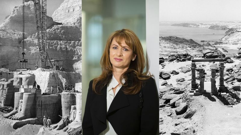 Composite of three images: color portrait of a light skinned, brown haired woman wearing a dark blazer and white shirt in the center, flanked by two black and white photographs of a crane moving a large stone Egyptian monument of a seated figure