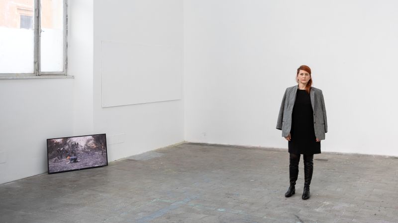 A woman in a large studio