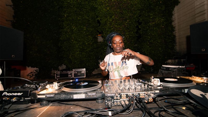 Color photo of a female DJ