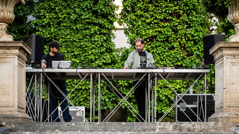 Color photo of two male DJs