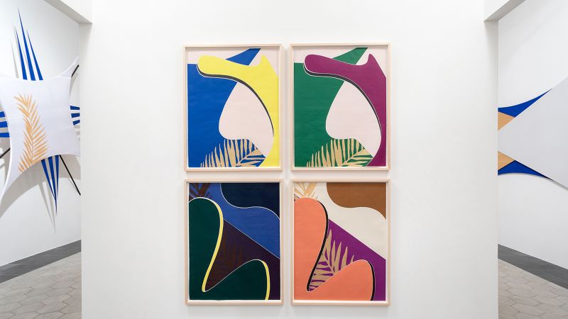 Color photograph of four abstract screenprints hanging as a group on a wall