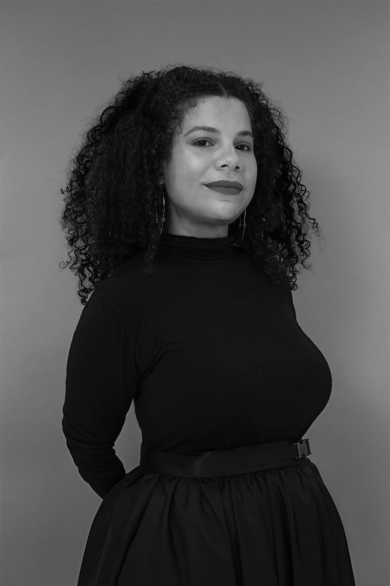 Black and white photograph of Firelei Báez from the waist up