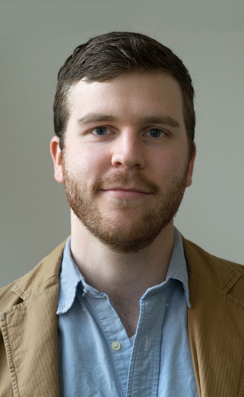 Color portrait of William Dougherty, wearing a light blue shirt and tan sportscoat