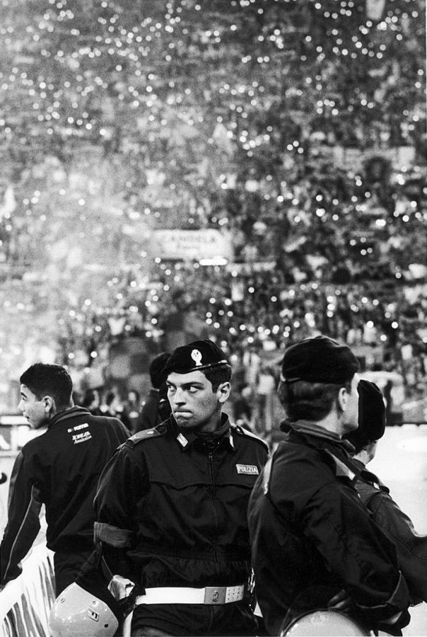 Black and white photograph of three Italian policemen